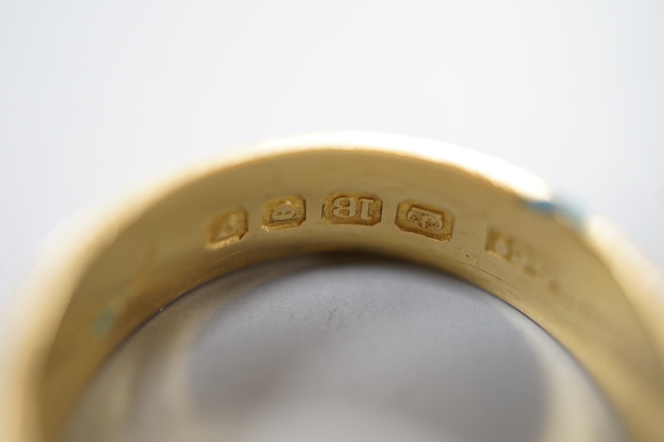 An engraved 18ct gold wedding band, size Q, 5.2 and a yellow metal band, 3.2 grams.